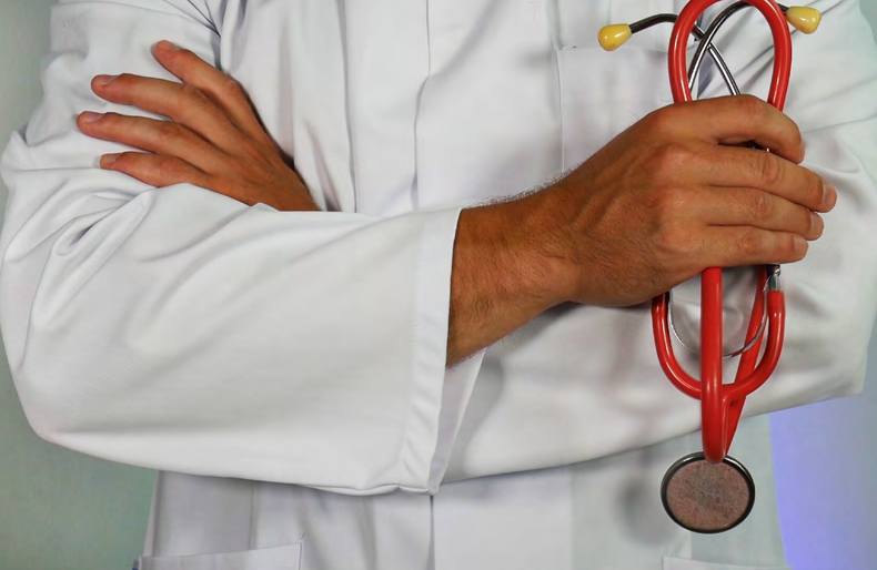 Doctor in lab coat with stethoscope