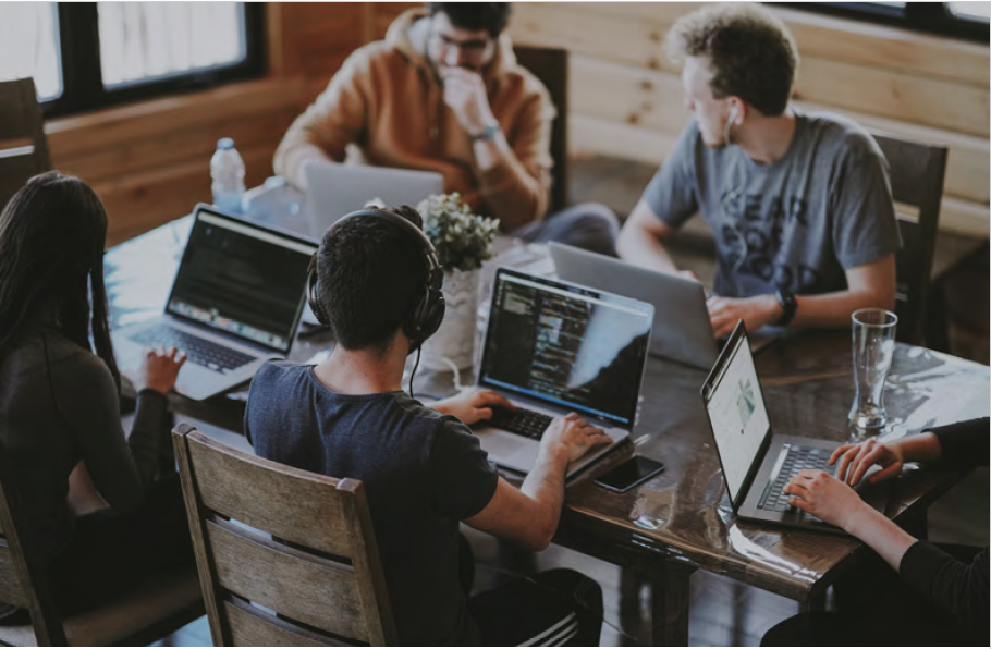 People working on laptops at a table